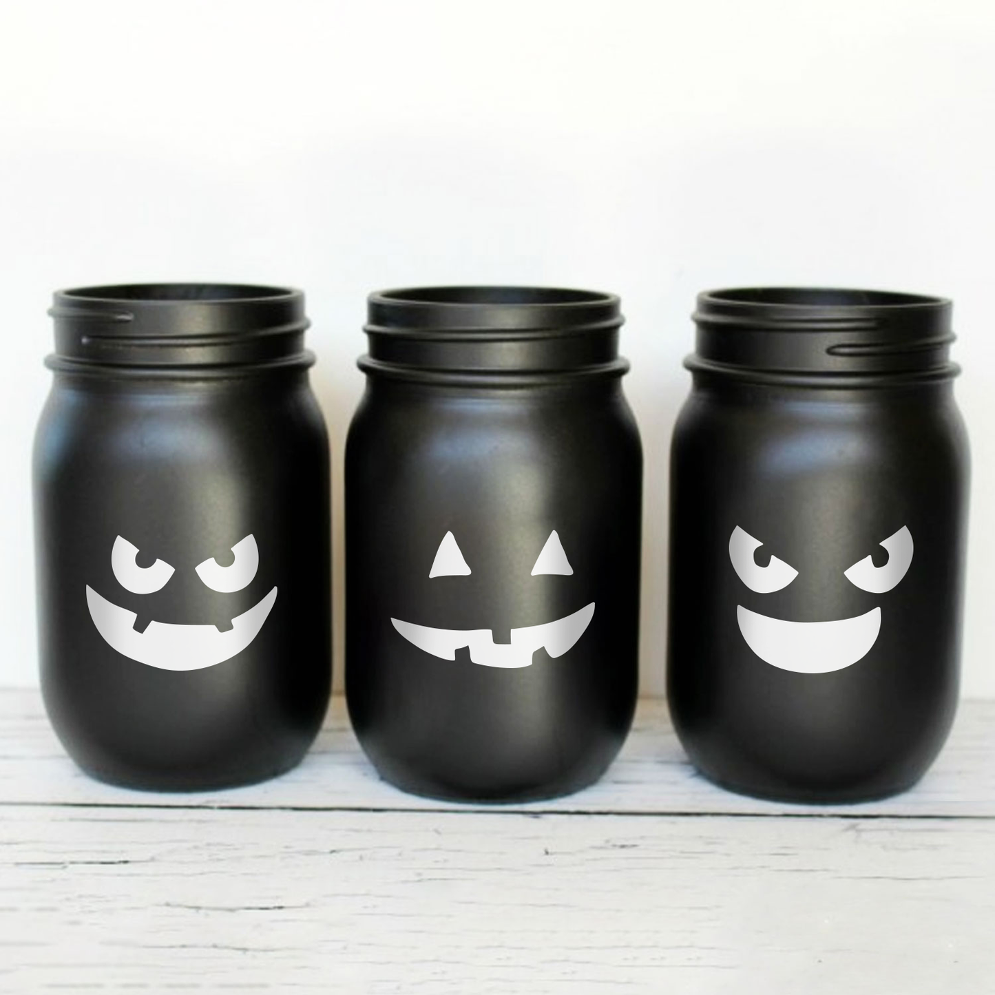 Vinyl Wall Art Decal - Set of 4 Spooky Faces - from 2-2.5" to 3" Each - Modern Cute Halloween Design for Coffee Mug Glasses Containers Seasonal Decoration Sticker